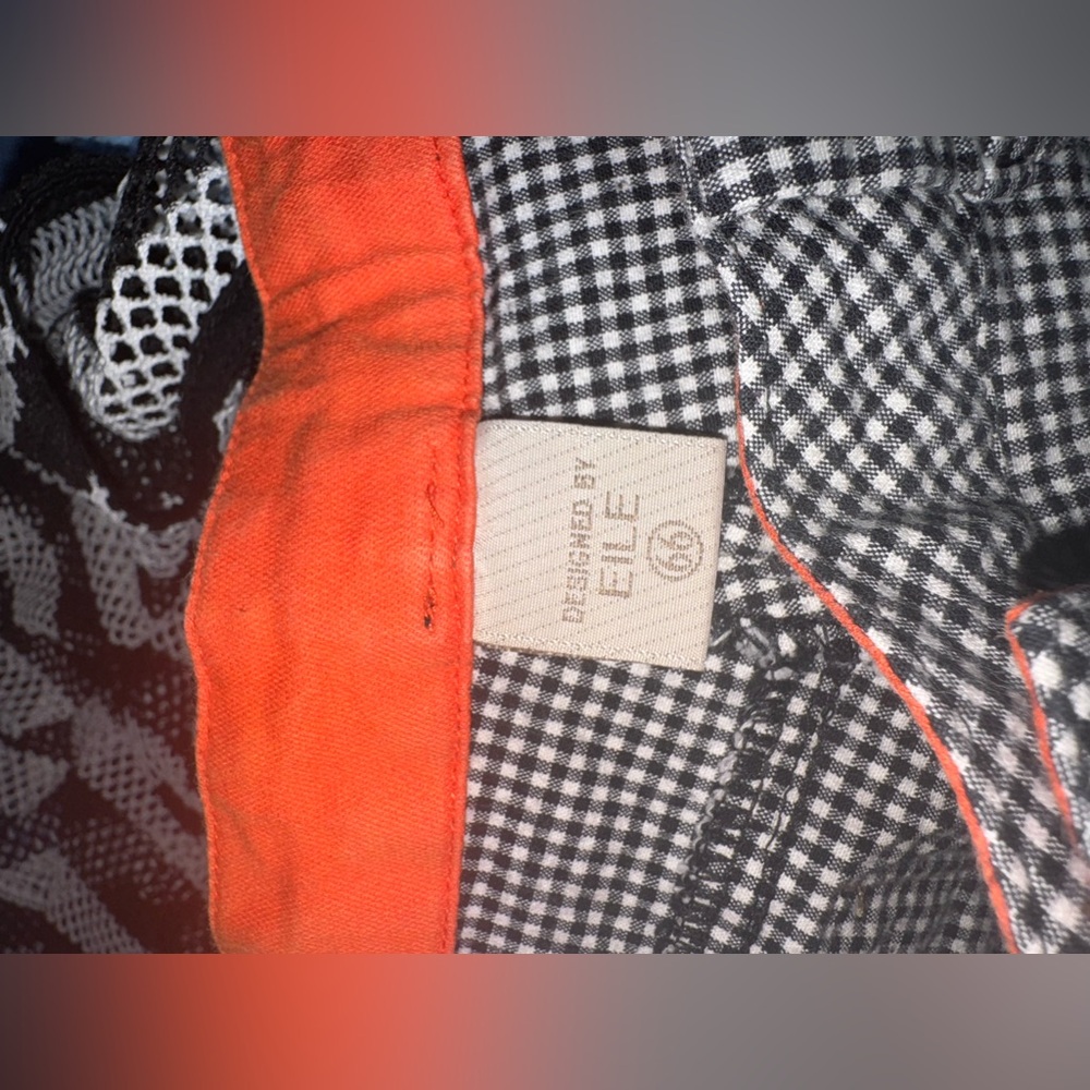 Eile Black and White Checkered captis with Orange Trim inside